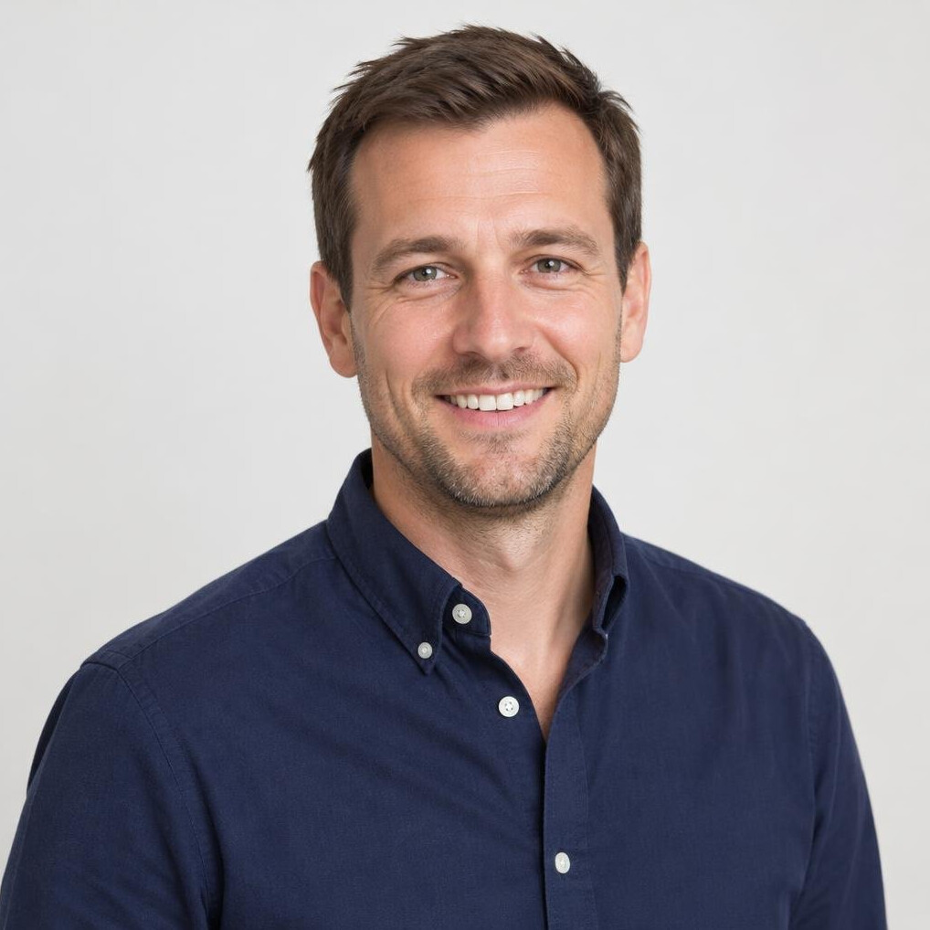Portrait of a smiling man in his thirties with short brown hair