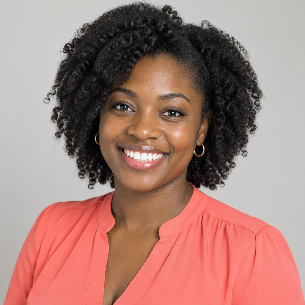 Portrait of a smiling Black woman with natural hair